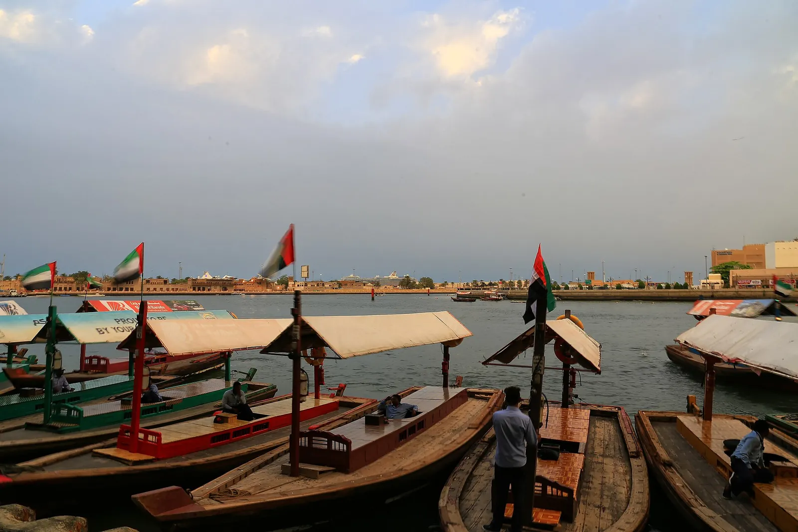 Wooden abra water taxi crossing Dubai Creek between Bur Dubai and Deira