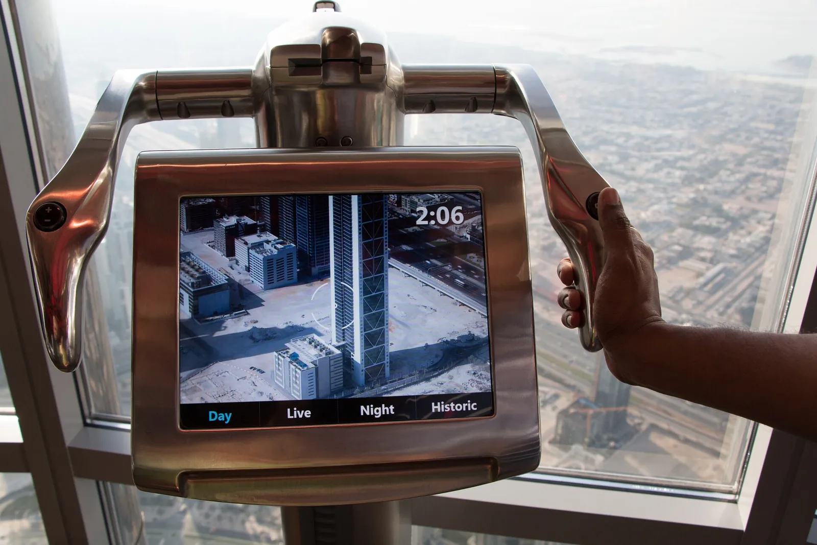 Digital telescope on the At the Top observation deck of the Burj Khalifa, with Dubai far below