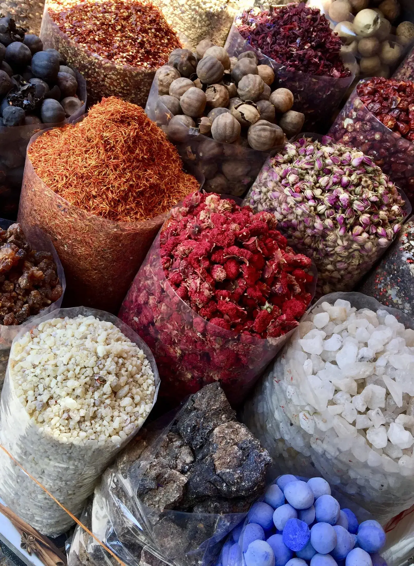Sacks of spices and dried flowers on display in the Spice Souk in Deira, Dubai