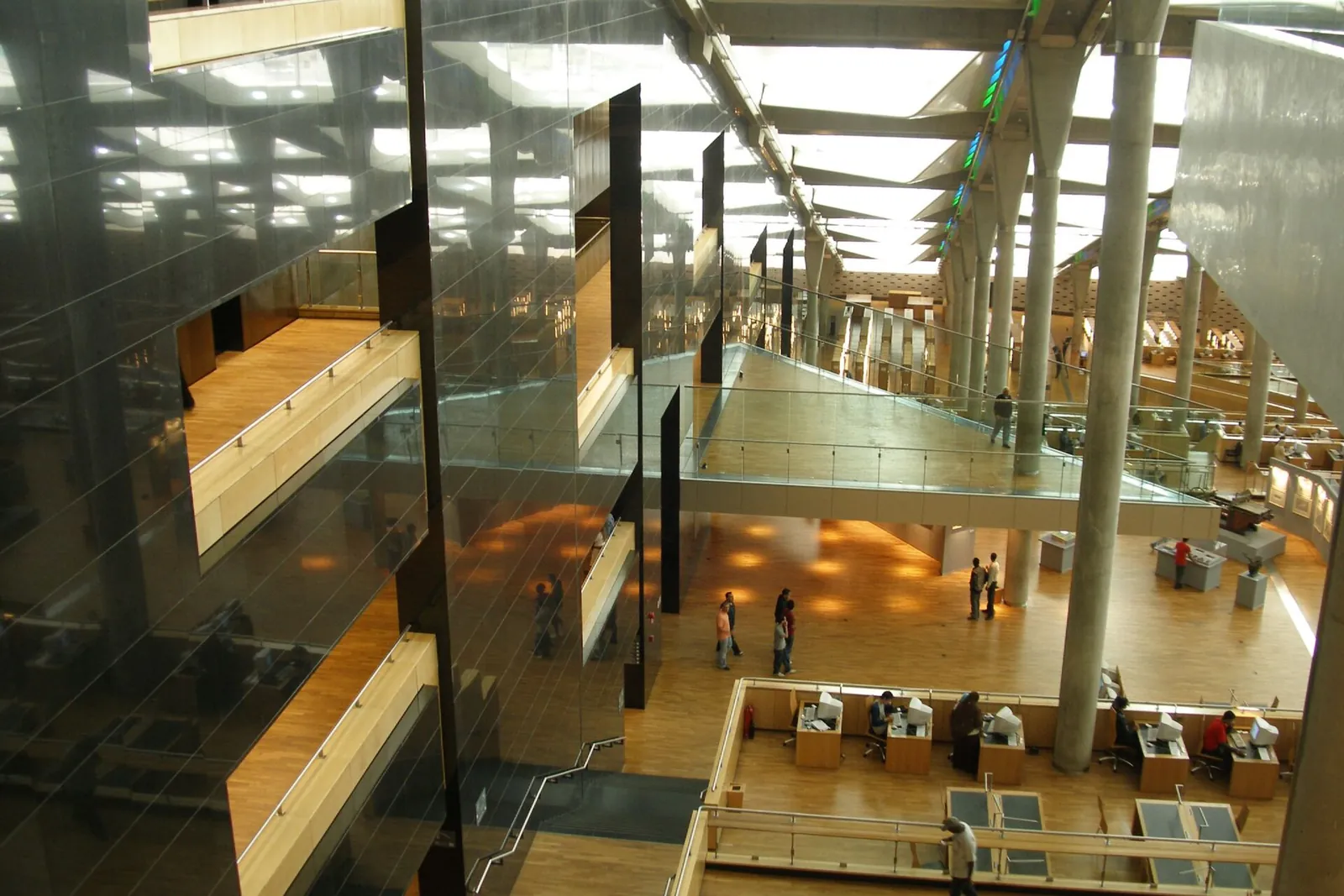 Sloping terraced reading room under the angled roof of the Bibliotheca Alexandrina in Alexandria