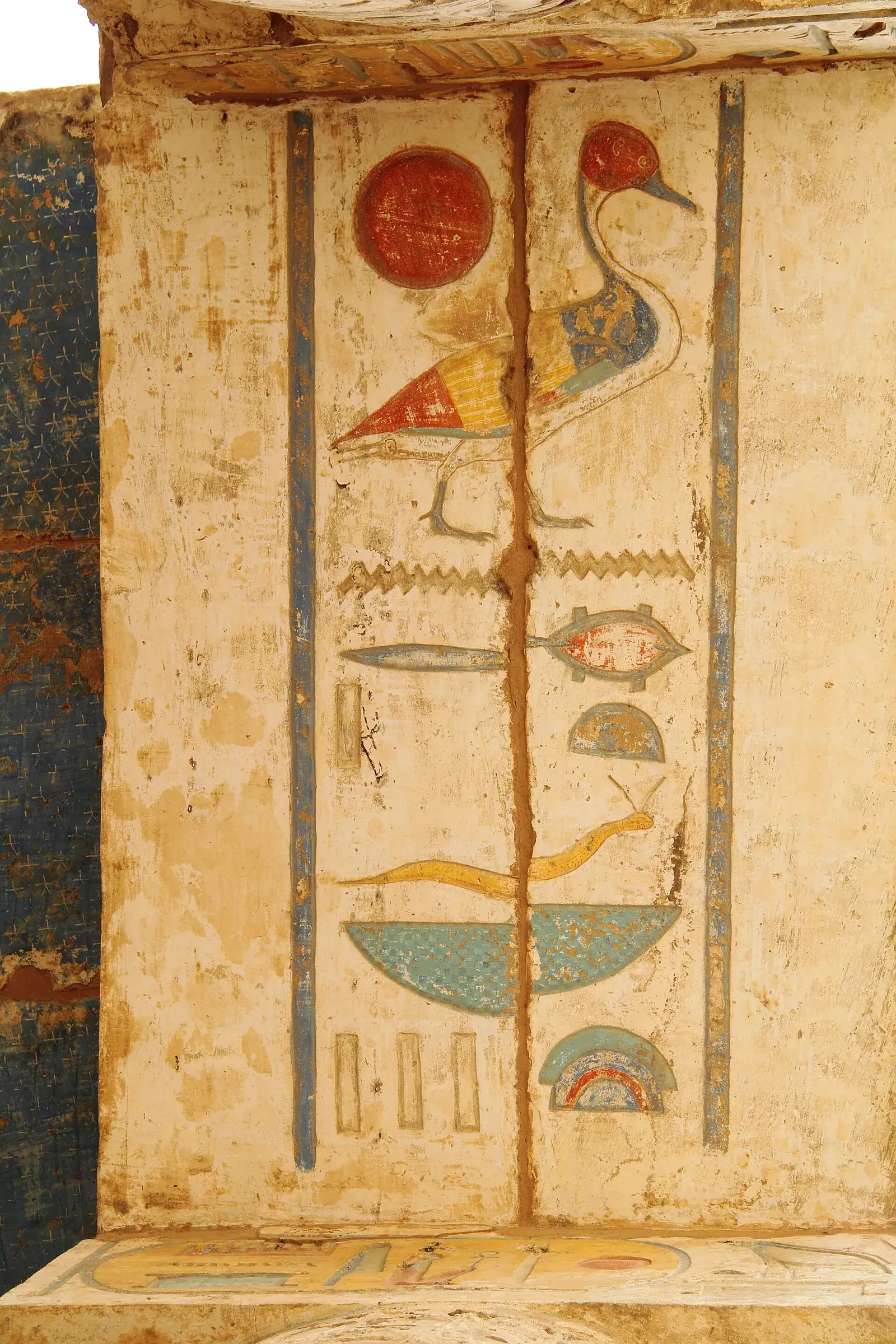 Painted hieroglyphs of a duck, sun disc and snake on a column at Medinet Habu, Luxor