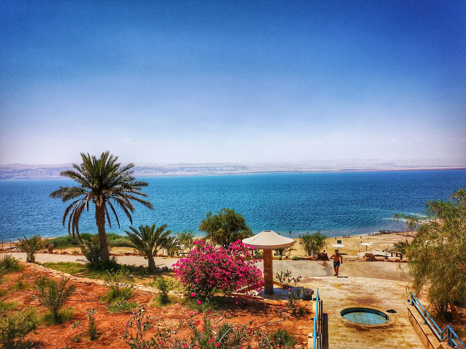 Salt-crusted pebble beach on the Jordanian shore of the Dead Sea