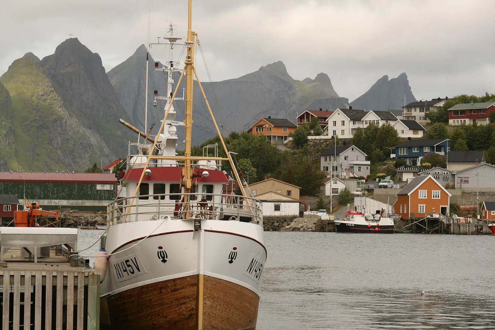 Snow-covered Olstind peak above the fishing village of Reine in Lofoten in winter